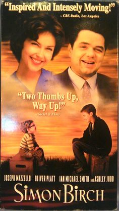 the movie simon birch is shown in front of a blurry background with an image of two people