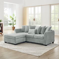 a living room scene with focus on the corner sofa