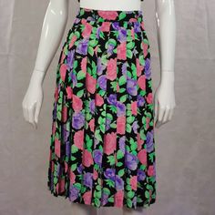 This is a cottage garden, luxury Andre Laug couture skirt from the 1980s. It has a fitted elasticated waist with side button fastening. Pleated below the knee bottom. Made in a 100% pure silk material with a pastel rose floral print. Sold in excellent condition. size estimate: l - xl UK: 16 - 18 US: 14 - 16 EU: 44 - 46 measurements: waist: 36 inch  hips: free length: 26.5 inch  Thank you for looking and please let me know if you have any questions - I am always happy and quick to help 🦋 ❤️ Clic Vintage Pleated Lined Skirt For Spring, Vintage Knee-length Pleated Spring Skirt, Vintage Spring Midi Pleated Skirt, Vintage Spring Pleated Midi Skirt, Vintage Lined Pleated Skirt For Summer, Vintage Pleated Skirt For Spring, Vintage Full Pleated Skirt For Spring, Vintage Pleated Midi Skirt For Spring, Spring Vintage Pleated Skirt