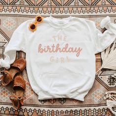 Looking for a cute sweatshirt for your kids? We have the perfect The Birthday Girl graphic sweatshirt addition to their closet! Also available in toddler sweatshirts. Casual Birthday Sweatshirt With Lettering, Long Sleeve Fall Birthday Sweatshirt, Casual Sweatshirt With Lettering For Birthday, White Casual Sweatshirt For Birthday, Casual White Sweatshirt For Birthday, Fall Birthday Cotton Sweatshirt, White Sweatshirt With Name Print For Birthday, Cute Crew Neck Birthday Sweater, Birthday Long Sleeve Tops With Lettering