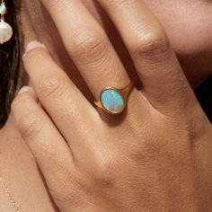 Dainty Opal Ring - Pear Opal Ring - White Opal And Cz Ring - Stacking Opal Ring - Gold Opal Ring - Silver Opal Ring - Bridesmaid Gift About The Ring:- Main Stone - Natural Ethiopian Fire Opal Stone Size - 9X7 MM Origin - Natural Color - Multi Fire Color  Setting Type - Bezel Metal - Select from the given options Metal Purity - 925 Silver, Solid Yellow Gold Metal Stamp - Yes Feel free to contact us, If you have any queries we will happy to help you. Plating on Silver - All items are plated with Rhodium which protects your skin from turning to green also scratch-free and long-lasting and shines bright Carving on the ring - Yes available price according to letters in your name Note:- I accept orders in 9K, 18K, 14k, and 22k Gold/White Gold/Rose Gold. This ring is made of fine Silver, making t Minimalist Oval Cabochon Opal Ring As Gift, Opal Oval Cabochon Ring For Gift, Unique Adjustable Gold Opal Ring, Pear Opal Ring, Unique 14k Gold Opal Cabochon Ring, Gold Opal Ring As Gift, Oval Cabochon, Amethyst Wedding, Silver Opal Ring, White Opal Ring