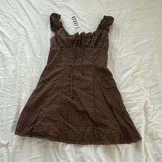 Urban Outfitters Blair Eyelet Mini Dress Size Small Condition: Nwt Color: Brown Details : - Light And Airy Uo Mini Dress In An Allover Eyelet. - Femme Silhouette With Ruffle Trim And A Cutout At The Empire Bust. - Wide Square Neckline - Cutout Tie At The Empire Bust - Smocking At The Back - Ruffle Trim - Body-Skimming Fit - Mini Length Extra: - I Ship Between 1-2 Days Casual Lined Mini Dress By Urban Outfitters, Casual Ruffled Mini Dress By Urban Outfitters, Urban Outfitters Casual Ruffled Mini Dress, Urban Outfitters Casual Mini Dress With Ruffles, Lined Mini Dress From Urban Outfitters, Spring Brown Mini Dress From Urban Outfitters, Urban Outfitters Lined Mini Dress, Urban Outfitters Mini Dress With Ruffles, Urban Outfitters Brown Summer Dress