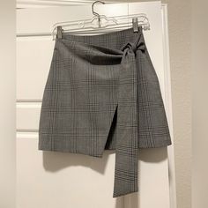 Grey Plaid Wrap Mini Skirt From Aritzia. Size Xs. Never Worn/Excellent Condition. Chic High Waist Gray Mini Skirt, Chic High-waist Gray Mini Skirt, Elegant High Waist Gray Skirt, Chic Gray Mini Skort, Chic Gray Skort For Spring, Gray Mini Skirt For Work, Chic Gray Pleated Mini Skirt, Elegant Gray Mini Skirt For Spring, Chic Gray Mini Skirt For Work