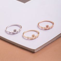 three different rings sitting on top of a table