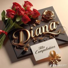 a bouquet of red roses sitting on top of a black sign that says diana