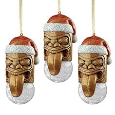 three christmas ornaments with santa hats on them