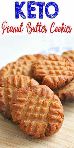 three peanut butter cookies sitting on top of a wooden cutting board with the words keto written