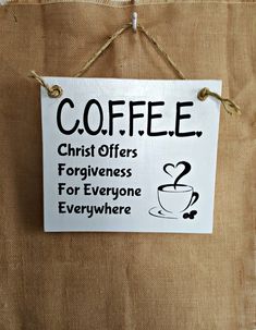 a sign hanging on the side of a bag that says coffee christ offers forgingness for everyone everywhere