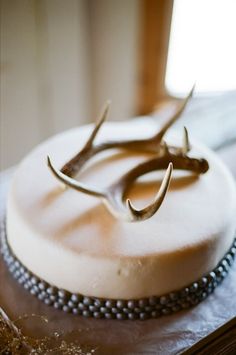 a close up of a cake on a table with the words corrus christ wedding from phenom photographers