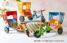 several colorful toy tricycles sitting next to each other