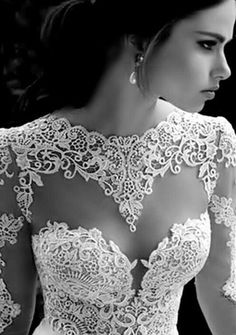 black and white photograph of a woman wearing a wedding dress with lace on the back