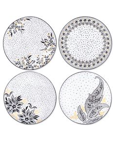 four plates with designs on them are shown in three different colors and sizes, one is white