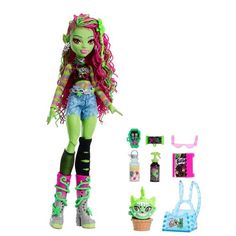 the monster doll has green hair and is next to her accessories, including an ice cream cone