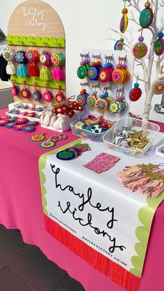 there is a table with many items on it that are for sale at the market