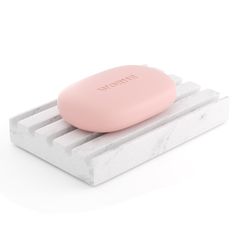 a soap bar sitting on top of a marble block