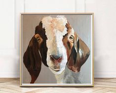 a painting of a goat is shown in front of a white wall and wooden floor