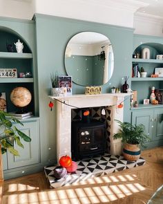 a living room filled with furniture and a fire place in the middle of a room