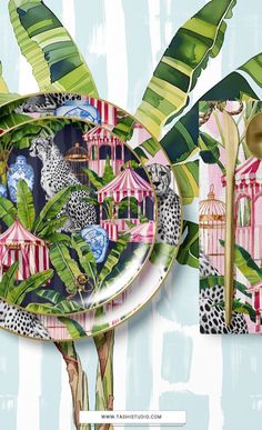 a plate with leopards and birds on it next to a palm tree, which is decorated with birdcages