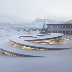 the building is surrounded by snow and has many circular designs on it's sides