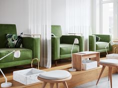 a living room filled with green couches and chairs