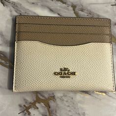 Coach Mini Skinny Id Holder In Tan/Cream. New With Tags, Please Post Questions. Picture Is Of Mine (Identical) The One I’m Selling Is Still In Original Packaging! Classic Everyday Cream Wallet, Classic Beige Card Holder For Everyday Use, Everyday Cream Wallet With Interior Card Slots, Elegant Cream Wallet For Everyday Use, Elegant Cream Wallets For Everyday Use, Everyday Beige Card Holder With Interior Slots, Elegant Beige Wallets For Everyday Use, Elegant Beige Everyday Wallets, Elegant Everyday Beige Wallets