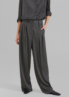 Color: Black Pinstripe Lightweight fluid fabric Relaxed fit Wide leg Double pleat detail Side seam hip pockets Hook and bar closure Zip fly Unlined 100% Polyester Dry Clean By The Frankie Shop. Imported Striped Wide Leg Pants With Elastic Waistband For Work, Chic Black Bottoms With Contrast Stripes, Elegant High Waist Pinstripe Pants, Elegant High-waist Pinstripe Pants, High Waist Striped Pants With Belt Loops, Chic Striped Pants With Elastic Waistband, Striped Straight Leg Pants With Belt Loops, Striped Straight Leg Pants With Welt Pockets, Formal Striped High Waist Bottoms