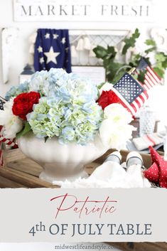 patriotic 4th of july table decor with flowers in a white bowl on a wooden tray