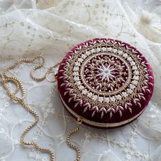 Embellished with pearls, zardozi, beads and sequins. It is the most regal of clutches. It comes with a bangle handle to hang on your wrist not given not given Velvet Black Clutch Bags, Potli Bag, Luxury Clutch, Potli Bags, Bridal Clutch, Fancy Bags, Wedding Bag