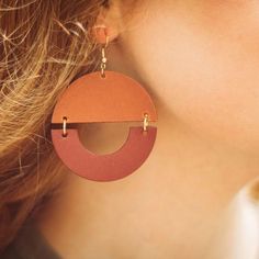 All the fun of big, bold geometric earrings with none of the weight! the Details ﻿- 3" drop x 2" W Bold Geometric Earrings With Bold Design, Modern Orange Earrings For Everyday Wear, Bold Geometric Designed Earrings, Bold Drop Earrings With Bold Design, Bold Geometric Earrings, Trendy Brown Earrings, Modern Handmade Hoop Earrings, Bold Handmade Geometric Earrings, Experience Gifts