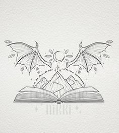 an open book with two dragon wings flying over it