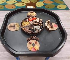 a black tray topped with lots of different items