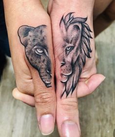 two people with tattoos on their hands holding each other's hands and one has a lion tattoo on it