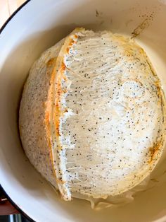 a white bowl filled with food on top of a table