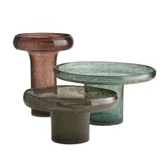 three different types of glass and wood dishes