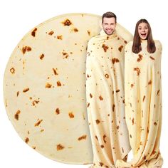 a man and woman dressed in burritos standing next to each other