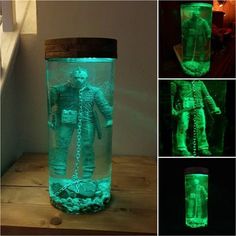 there is a glass jar that has glow in the dark with a man inside it