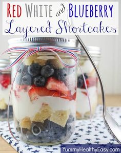 red, white and blueberry layered shortcakes in a jar