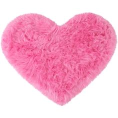 a pink heart shaped pillow on a white background