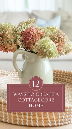 a white vase filled with pink and green flowers on top of a wicker tray