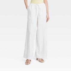 These High-Rise Wide-Leg Linen Pull-On Pants from A New Day™ make a great pick for warm-weather wear. Fashioned in comfortable wide-leg silhouette, they bring relaxed style to your look. The functional drawstring on the pull-on waist lets you get the perfect fit with every wear, and the functional pockets provide space for on-the-go essentials. A New Day™: Style that goes wherever you do. White Linen Pants Outfit, Wide Leg White Linen Pants, Linen Pants White, Coral Pants, Linen Pants Outfit, Linen Drawstring Pants, Work Fits, White Linen Pants, Cotton Linen Pants