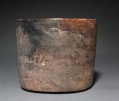 a large brown pot sitting on top of a table