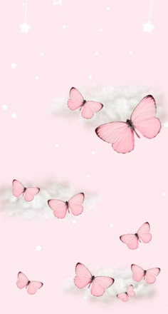 pink butterflies flying in the sky with white stars on it's backgrund