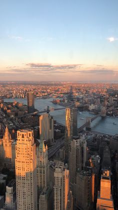 an aerial view of new york city at sunset