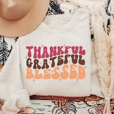 Show you're thankful for all the blessings and good things in your life in this sweatshirt! It's perfect for a yummy post-thanksgiving meal. We recommend to size up 1-3 sizes for an oversized feel :) Note: ♡ Our products are made to order specially for you. We have included size charts and a quick memo on finding the perfect size! ♡ We don't accept returns or exchanges. Please check our color and size charts before you place your order :) ♡ Please make sure all shipping information is correct be Mom Thanksgiving Shirt, Thanksgiving Mom, Thanksgiving Sweatshirt, Thankful Shirt, Thanksgiving Meal, Thankful Grateful Blessed, Grateful Thankful Blessed, Tshirt Ideas, Thanksgiving Shirt