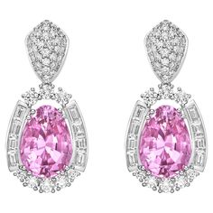 This collection features an array of Pink Tourmaline with a Pink hue that is as cool as it gets! Accented with diamonds these earrings are made in white gold and present a classic yet elegant look.. Pink Tourmaline Drop Earrings in 18 Karat White Gold with Diamond. Pink Tourmaline: 11.19 carat, 9.6X13mm Size, pear Shape. Diamond: 0.85 carat, 2.8X2mm Size, baguette shape, G color, VS Clarity. Diamond: 0.24 carat, 2.8X3.1X2mm Size, Tapper baguette shape, G color, VS Clarity. Diamond: 0.64 carat, 2 Luxury Brilliant Cut Pink Diamond Earrings, Pink Diamond Earrings, Mens Diamond Jewelry, Gold Butterfly, Dream Jewelry, Pink Diamond, High Jewelry, Pink Tourmaline, Cute Earrings