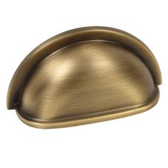 an antique brass cabinet door handle on a white background