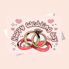 two wedding rings on top of each other with hearts around them and the words happy married