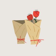 two flowers are wrapped in brown paper