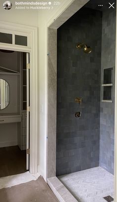 a walk in shower sitting inside of a bathroom