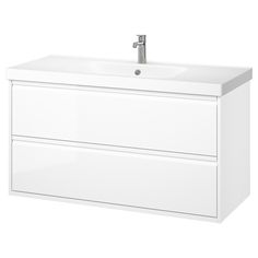 a white bathroom vanity with two drawers and a faucet on the sink side